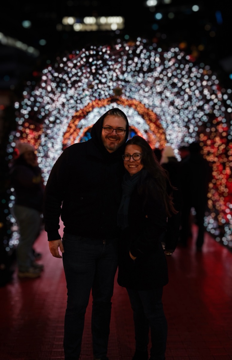Jim and Alysha portrait with holiday lights